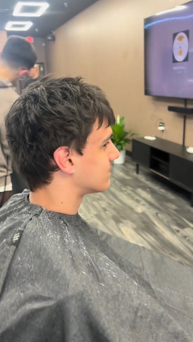 Client with a sculpted beard and sharp lineup