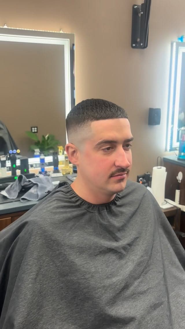 Client with a precision skin fade and textured crop
